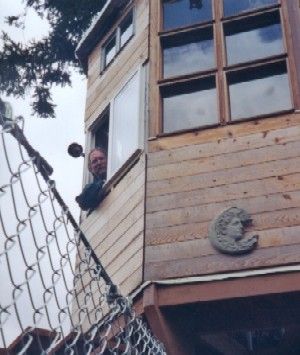 Treehouse owner and builder Bill Compher peers down from a window in the Observatory while dreaming up new schemes. Stay tuned ..